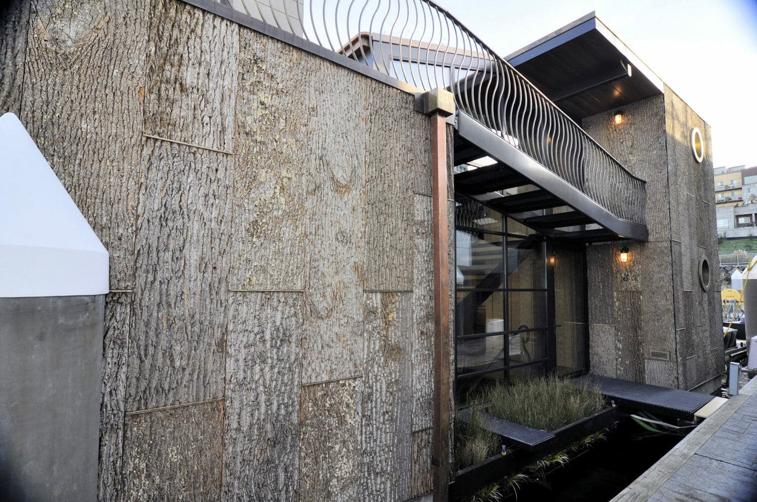 Wood exterior siding in tulip poplar protects this Seattle houseboat