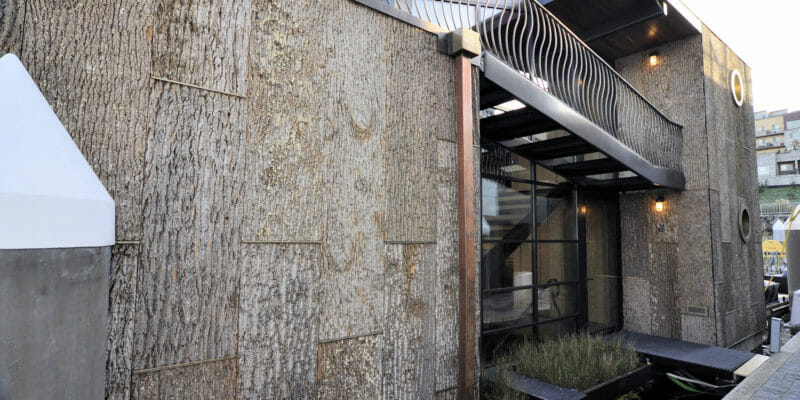 Wood exterior siding in tulip poplar protects this Seattle houseboat