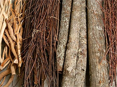 Twigs and poles that The Bark House at Highland Craftsmen uses for elegant or rustic architectural design elements