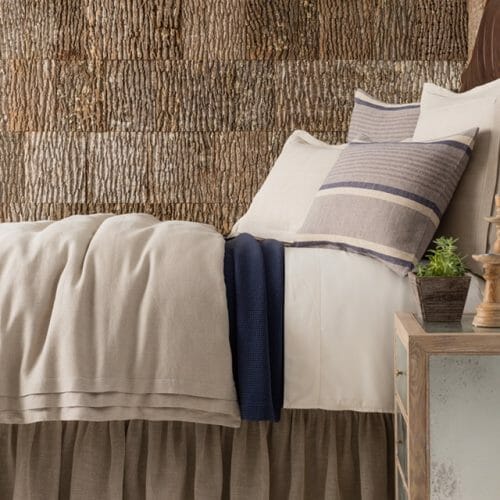 Annie Selke, Pine Cone Hill, uses Bark House Poplar Bark interior shingles for a beautiful backdrop to her bedding: beige
