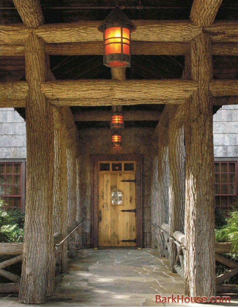 Bark House at Highland Craftsmen's Bark Intact Poplar Poles support entry way