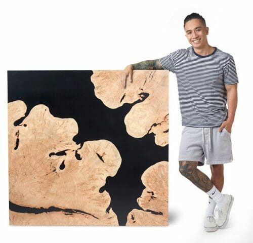 Artist Dan Nguyen with his Maple live edge slab from bark house
