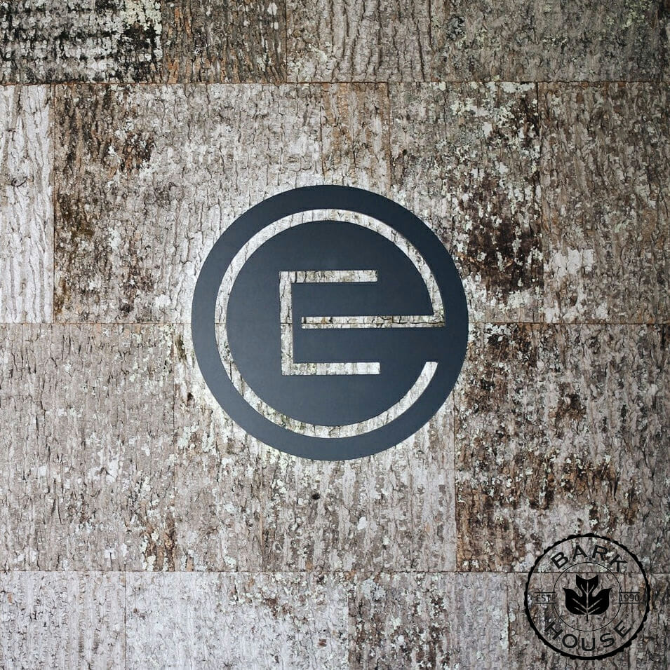 Earth Elements in Montana using the Bark House shingles as a backdrop for their logo